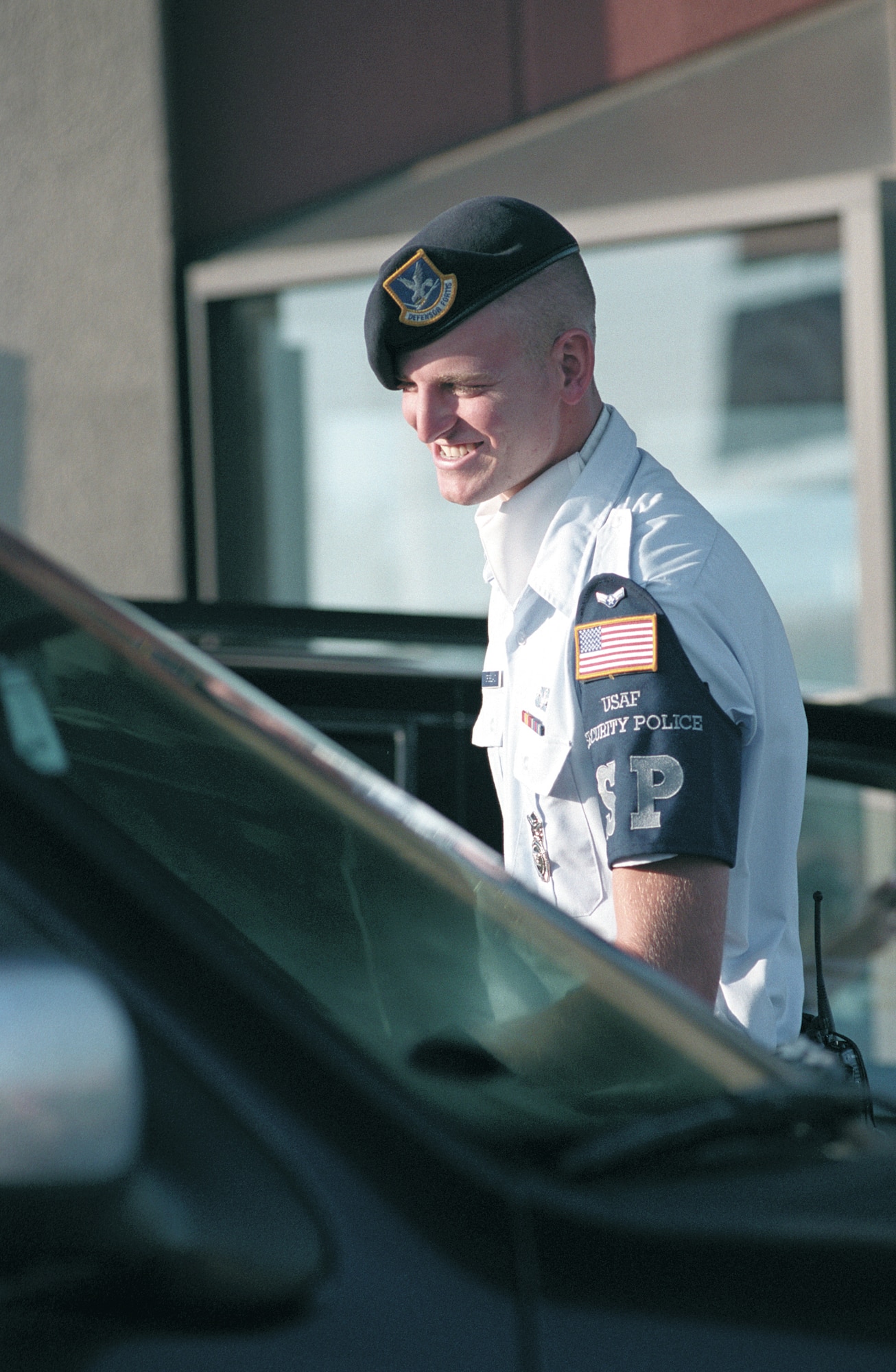 TINKER AIR FORCE BASE, Okla. -- Airman 1st Class Ragan Crossland finds something uplifting to say to every motorist he encounters at Tinker's gates.  He is assigned to the 72nd Security Forces Squadron.  (U.S. Air Force photo by Margo Wright)
