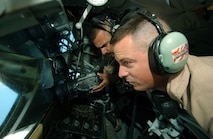 SOUTHWEST ASIA -- Tech. Sgt. Chris Nolan videotapes an aerial refueling mission Aug. 16 as Tech. Sgt. Patrick Bennett guides the KC-135 Stratotanker boom.  Sergeant Nolan is a combat videographer deployed from the 1st Combat Camera Squadron at Charleston Air Force Base, S.C.  Sergeant Bennett is a boom operator deployed from the 92nd Air Refueling Wing at Fairchild AFB, Wash.  (U.S. Air Force photo by Tech. Sgt. Scott Reed)