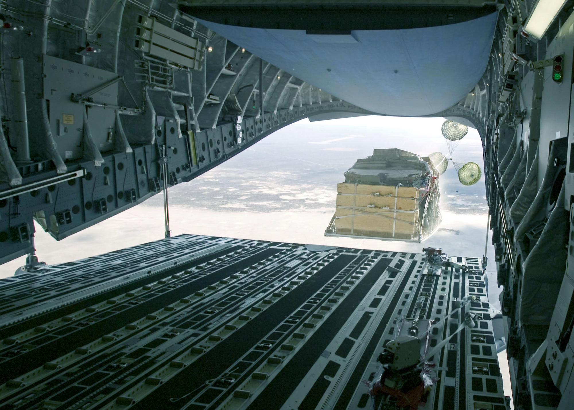EDWARDS AIR FORCE BASE, Calif. -- An Army Stryker engineer squad vehicle equipped with a mobile gun system is airdropped Aug. 13 from a C-17 Globemaster III from the 418th Flight Test Squadron here.  (U.S. Air Force photo by Kevin Kidd)