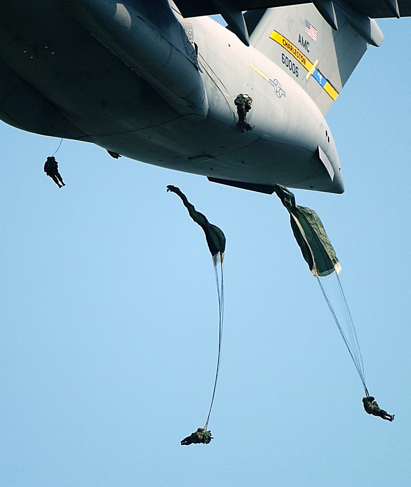 CHARLESTON, S.C. -- Members of the Army's 82nd Airborne Division from Fort Bragg, N.C., jump from a C-17 Globemaster III.  The jump was part of the 82nd Airborne Division Association's annual convention here.  Three hundred members of the 82nd exited from C-17s in six passes, 50 jumpers at a time. The transport is assigned to the 15th Airlift Squadron at Charleston Air Force Base, S.C.  (U.S. Air Force photo by Staff Sgt. Jeremy T. Lock)