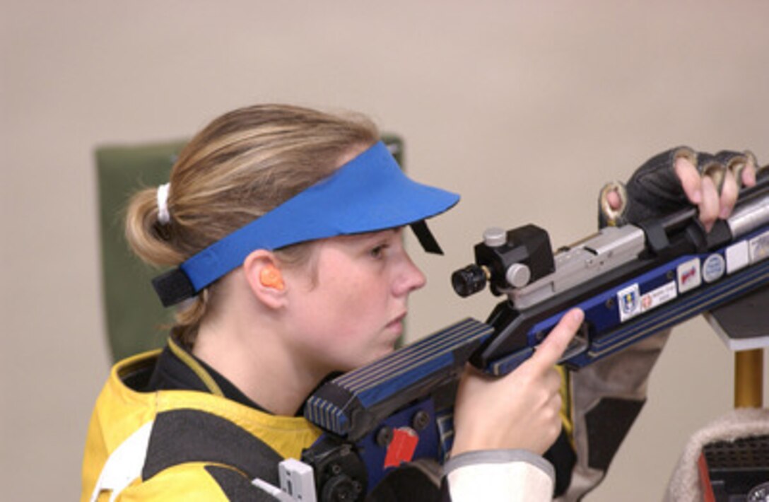 Army Spc. Hattie Johnson competes in the woman's 10-meter air rifle event at the 2004 Olympics in Athens, Greece on Aug. 14, 2004. The 22-year-old Johnson placed 14th in a field of 44 in her first Olympic competition. Johnson is assigned to the U.S. Army Marksmanship Unit at Fort Benning, Ga. 