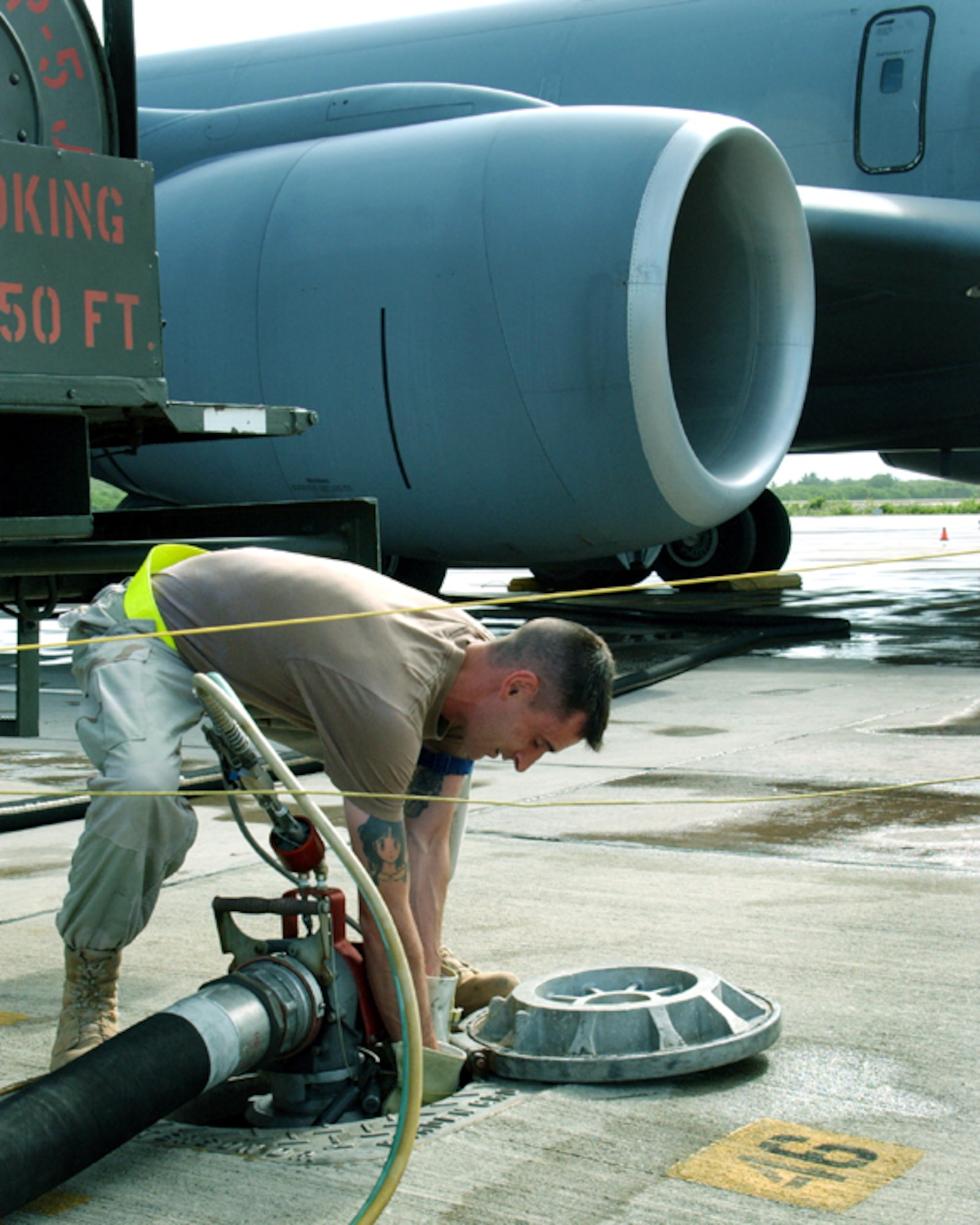 OPERATION ENDURING FREEDOM -- Senior Airman Thomas Haefliger hooks up sensing lines to a refueling outlet before refueling a KC-135 Stratotanker.  The fuels element Airmen here have issued more than 10 million gallons of aviation fuel.  Airman Haefliger is a refueling unit operator with the 40th Expeditionary Logistics Readiness Flight fuels element.  He is deployed from Fairchild Air Force Base, Wash.  (U.S. Air Force photo by Master Sgt. Sean Brennan)