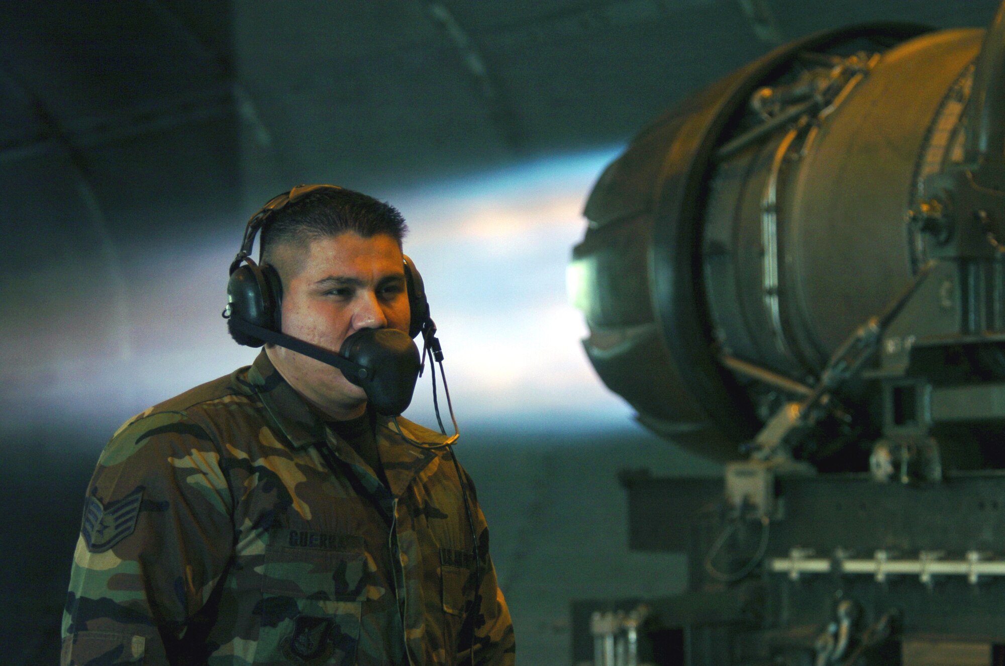 OSAN AIR BASE, South Korea -- Staff Sgt. Daniel Guerra looks for fuel leaks while an F-16 Fighting Falcon engine "runs" full blast at the test cell facility here.  Engine runs ensure that they are in top condition after repairs.  Sergeant Guerra is an engine propulsion mechanic assigned to the 51st Maintenance Squadron.  (U.S. Air Force photo by Master Sgt. Val Gempis) 
