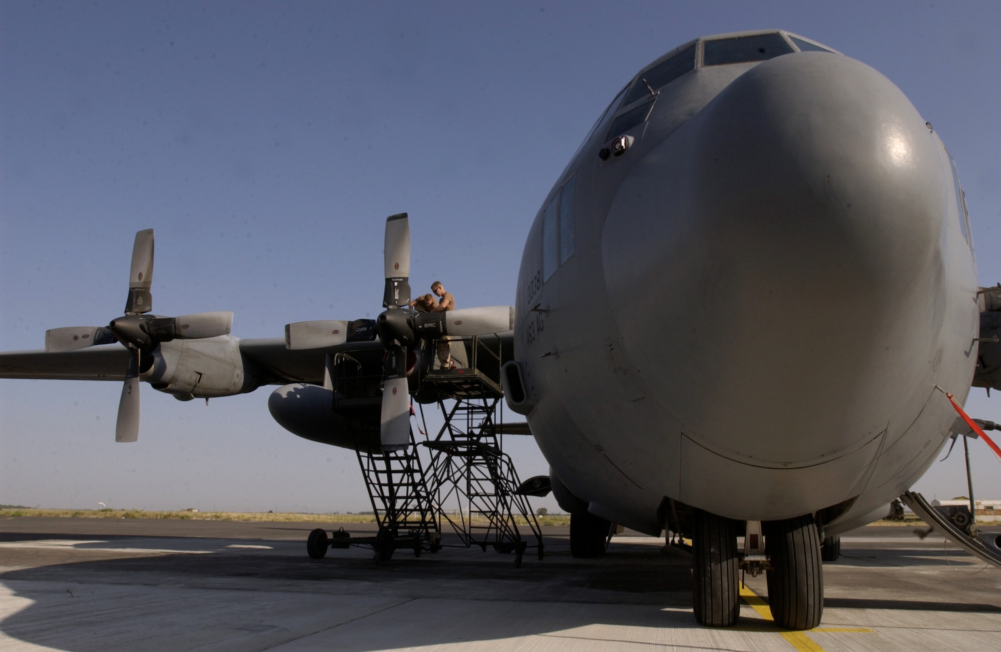 MANAS AIR BASE, Kyrgyzstan -- Senior Airman Derek Smith and Airman 1st Class Alex O'Donnell troubleshoot the source of an indicator light malfunction on the No. 3 engine on a C-130 Hercules here.  They are aircraft maintainers assigned to the 376th Expeditionary Air Maintenance Squadron and are deployed from Little Rock Air Force Base, Ark.  (U.S. Air Force photo by Master Sgt. Scott Wagers)