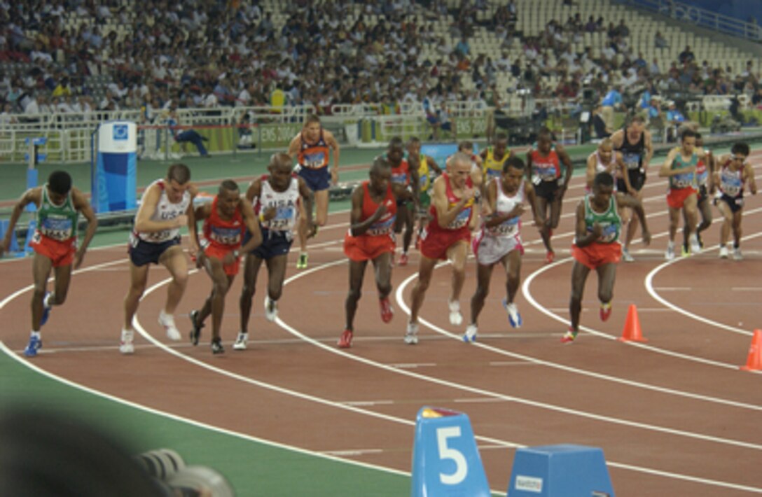 Oregon National Guard Capt. Dan Browne (2nd from the left) takes off at the start of the men's 10,000-meter final during the 2004 Olympics in Athens, Greece, on Aug. 20, 2004. Browne finished 12th in a field of 26 competitors. 
