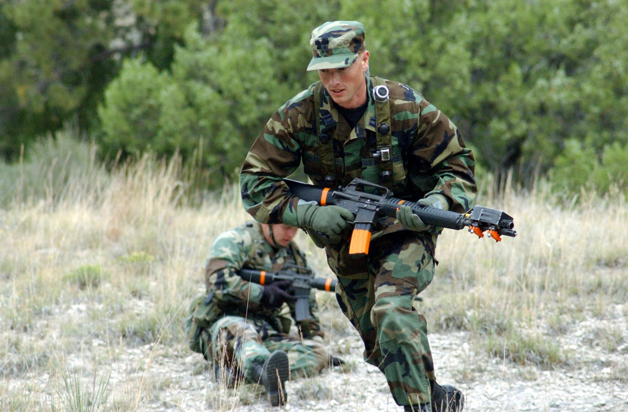 CAMP GUERNSEY, Wyo. -- Capt. Karl Seekamp runs to provide fire during the Road Warrior III exercise here.  He is a pilot with the 37th Helicopter Flight at F.E. Warren Air Force Base, Wyo.  (U.S. Air Force photo by Master Sgt. Jeff Bohn)