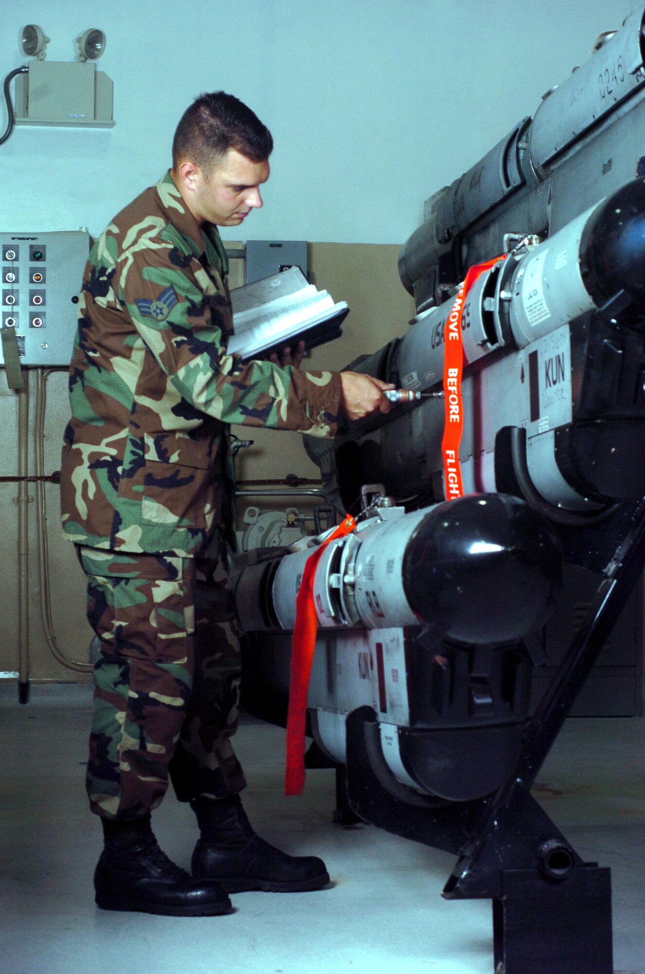 KUNSAN AIR BASE, South Korea -- Senior Airman Edward Youmans inspects an electronic countermeasures pod here.  The ECM technicians maintain the F-16 Fighting Falcons pods used to defeat sophisticated anti-aircraft defense systems.  Airman Youmans is assigned to the 8th Maintenance Squadron.  (U.S. Air Force photo by Master Sgt. Val Gempis)
