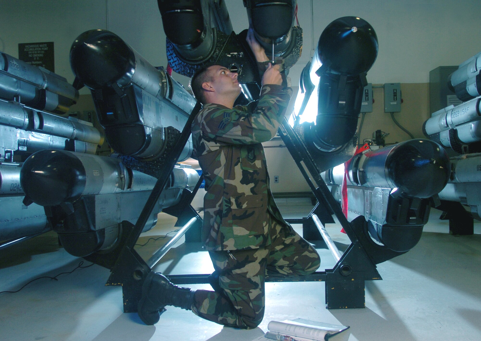 KUNSAN AIR BASE, South Korea -- Senior Airman Edward Youmans inspects the heat exchanger of an electronic countermeasures pod here.  The ECM technicians maintain the F-16 Fighting Falcons pods used to defeat sophisticated anti-aircraft defense systems.  Airman Youmans is assigned to the 8th Maintenance Squadron.  (U.S. Air Force photo by Master Sgt. Val Gempis)