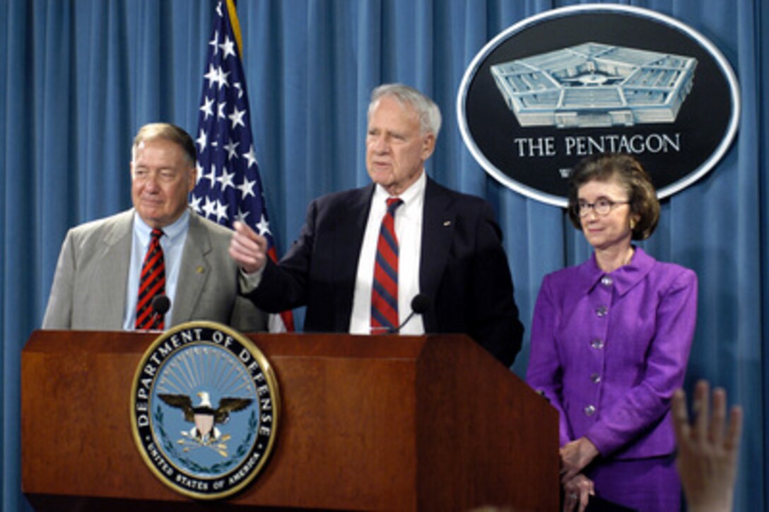 Chairman of the Independent Panel to Review Department of Defense Detention Operations James Schlesinger (center) is flanked by retired Air Force Gen. Charles A. Horner (left) and former U.S. Representative Tillie K. Fowler as he calls on a reporter during a Pentagon press conference following the delivery of their final report to Secretary of Defense Donald H. Rumsfeld, on Aug. 24, 2004. The panel members, along with former Secretary of Defense Harold Brown via telephone, talked with reporters about their findings and recommendations regarding the allegations and investigations of abuse at DoD detention facilities. Schlesinger was secretary of defense for Presidents Nixon and Ford and secretary of energy for President Carter. 
