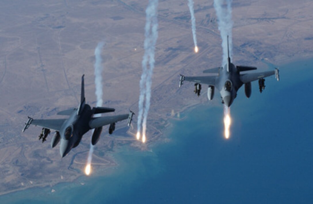 Two U.S. Air Force F-16C Fighting Falcons launch flares during a combat mission over Iraq on Aug. 18, 2004. The Falcons are attached to the 332nd Air Expeditionary Wing, Balad Air Base, Iraq. 