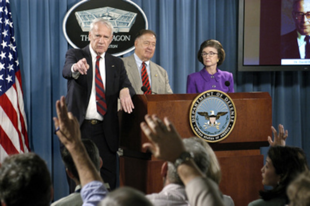 Chairman of the Independent Panel to Review Department of Defense Detention Operations James Schlesinger calls on a reporter during a Pentagon press conference following the delivery of their final report to Secretary of Defense Donald H. Rumsfeld, on Aug. 24, 2004. Retired Air Force Gen. Charles A. Horner (center), former U.S. Representative Tillie K. Fowler and former Secretary of Defense Harold Brown via telephone, joined Schlesinger to discuss the findings and recommendations allegations and investigations of abuse at DoD detention facilities. Schlesinger was secretary of defense for Presidents Nixon and Ford and secretary of energy for President Carter. 
