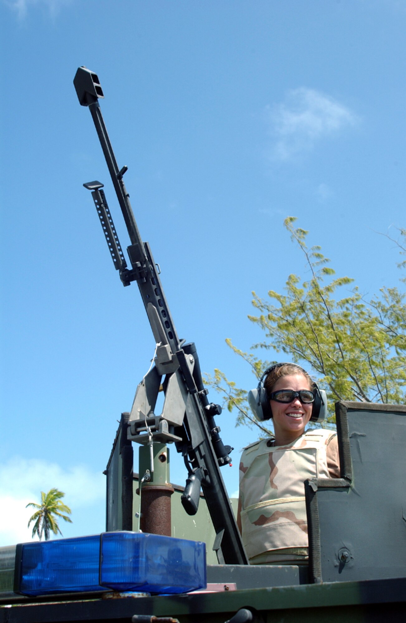 OPERATION ENDURING FREEDOM -- Senior Airman Sunshine Polk awaits approval to fires during an operation with a .50-caliber rifle on a training range at a forward-deployed location.  The explosive ordnance disposal technicians use the rifle to disrupt or destroy unexploded ordnance from a safe distance.  Airman Polk is assigned to the 40th Expeditionary Civil Engineer Flight and is deployed from Nellis Air Force Base, Nev.  (U.S. Air Force photo by Staff Sgt. Nathan Gallahan)