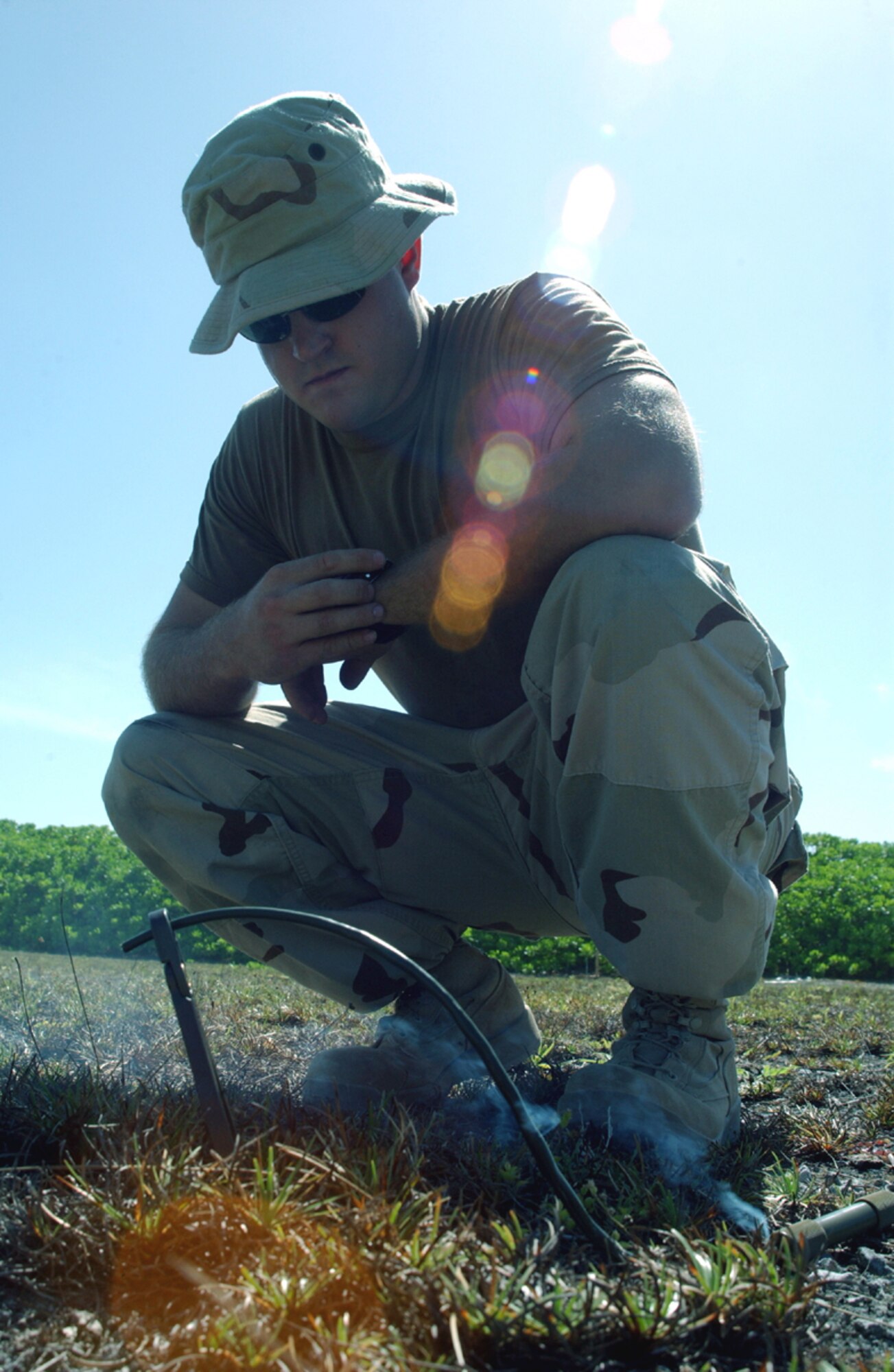 OPERATION ENDURING FREEDOM -- Senior Airman Phillip Dyer tests a fuse during training at a forward-deployed location Aug. 24.  The test lets the operation supervisor calculate detonation time.  Airman Dyer is an explosive ordnance disposal technician with the 40th Expeditionary Civil Engineer Flight.  He is deployed from Nellis Air Force Base, Nev.  (U.S. Air Force photo by Staff Sgt. Nathan Gallahan)