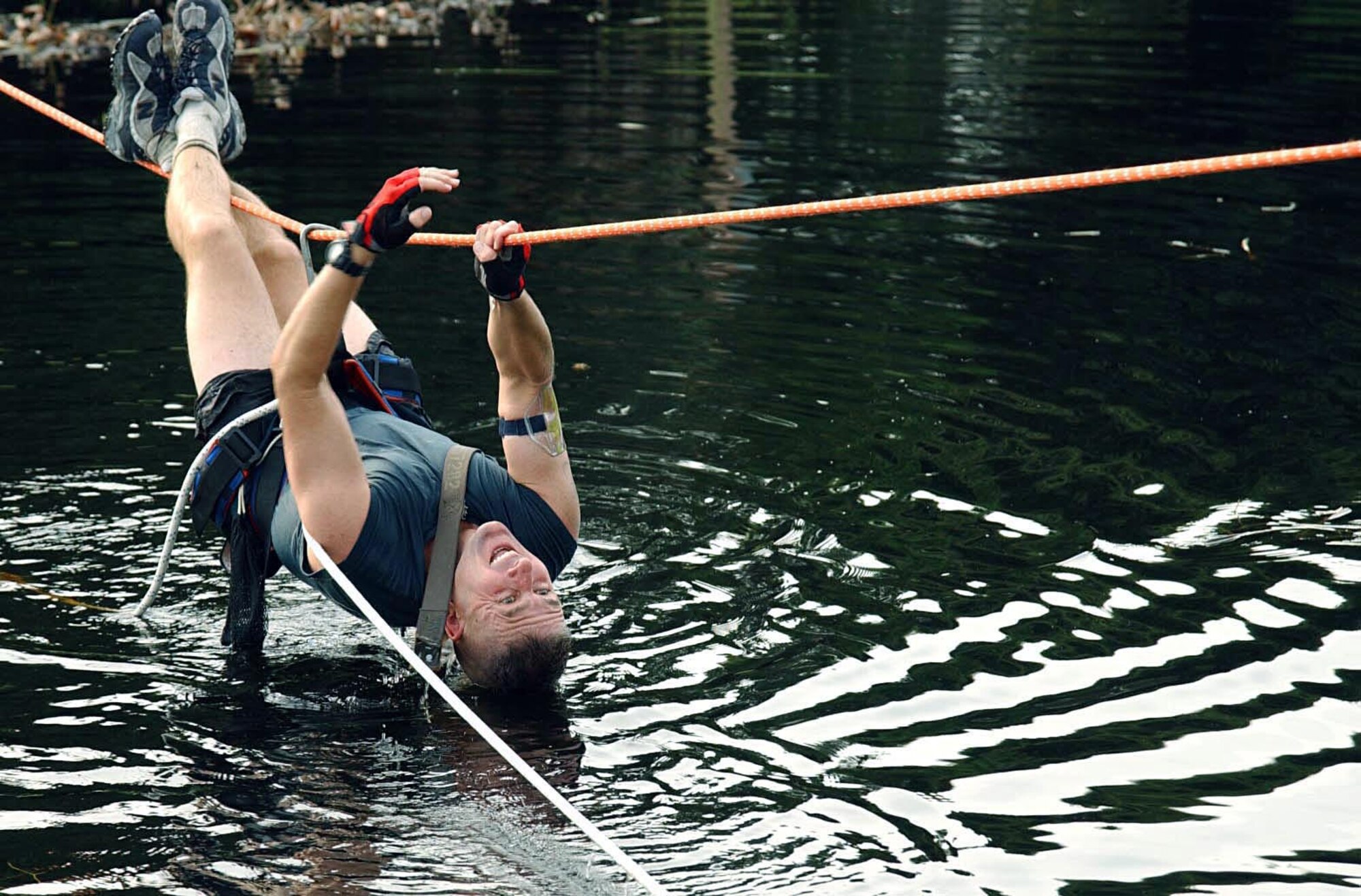 MACDILL AIR FORCE BASE, Fla. -- Army Maj. Drew Moores makes his way across Lewis Lake here during the Enduro Challenge Aug. 21.  His team eventually went on to win the adventure race with a time of 4 hours, 23 minutes and 15 seconds.  (U.S. Air Force photo by Staff Sgt. Randy Redman)