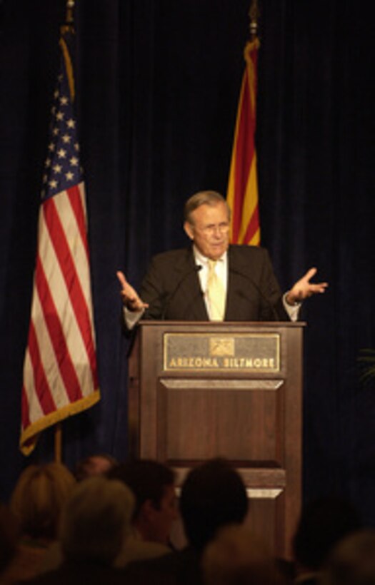 Secretary of Defense Donald H. Rumsfeld gestures to make his point as he gives the keynote address to members of the Greater Phoenix Leadership in Phoenix, Ariz., on Aug. 26, 2004. Rumsfeld provided an update on the global war on terror to approximately 300 members and their guests at the event. 