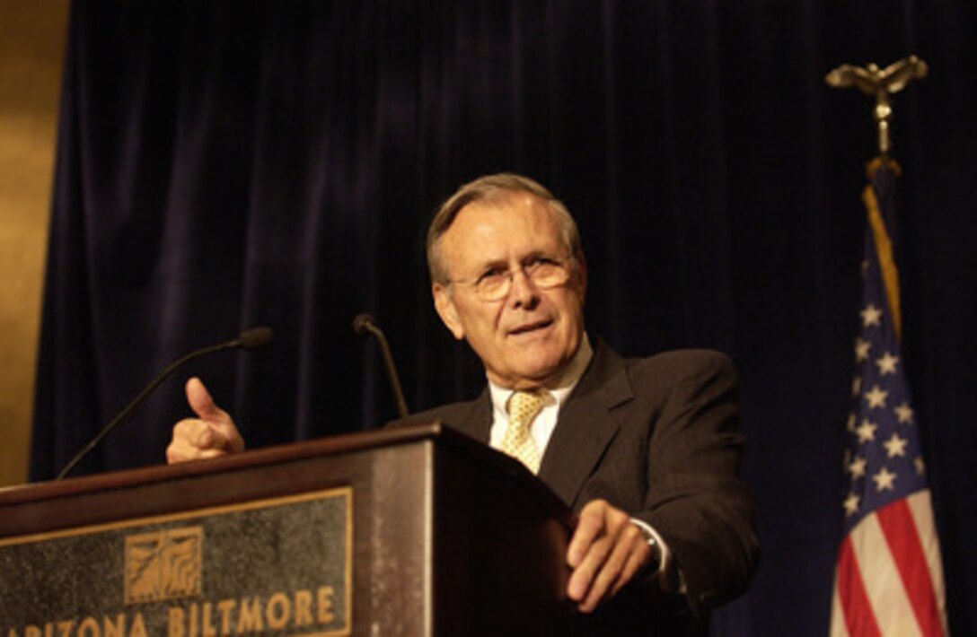 Secretary of Defense Donald H. Rumsfeld gestures to make his point as he gives the keynote address to members of the Greater Phoenix Leadership in Phoenix, Ariz., on Aug. 26, 2004. Rumsfeld provided an update on the global war on terror to approximately 300 members and their guests at the event. 