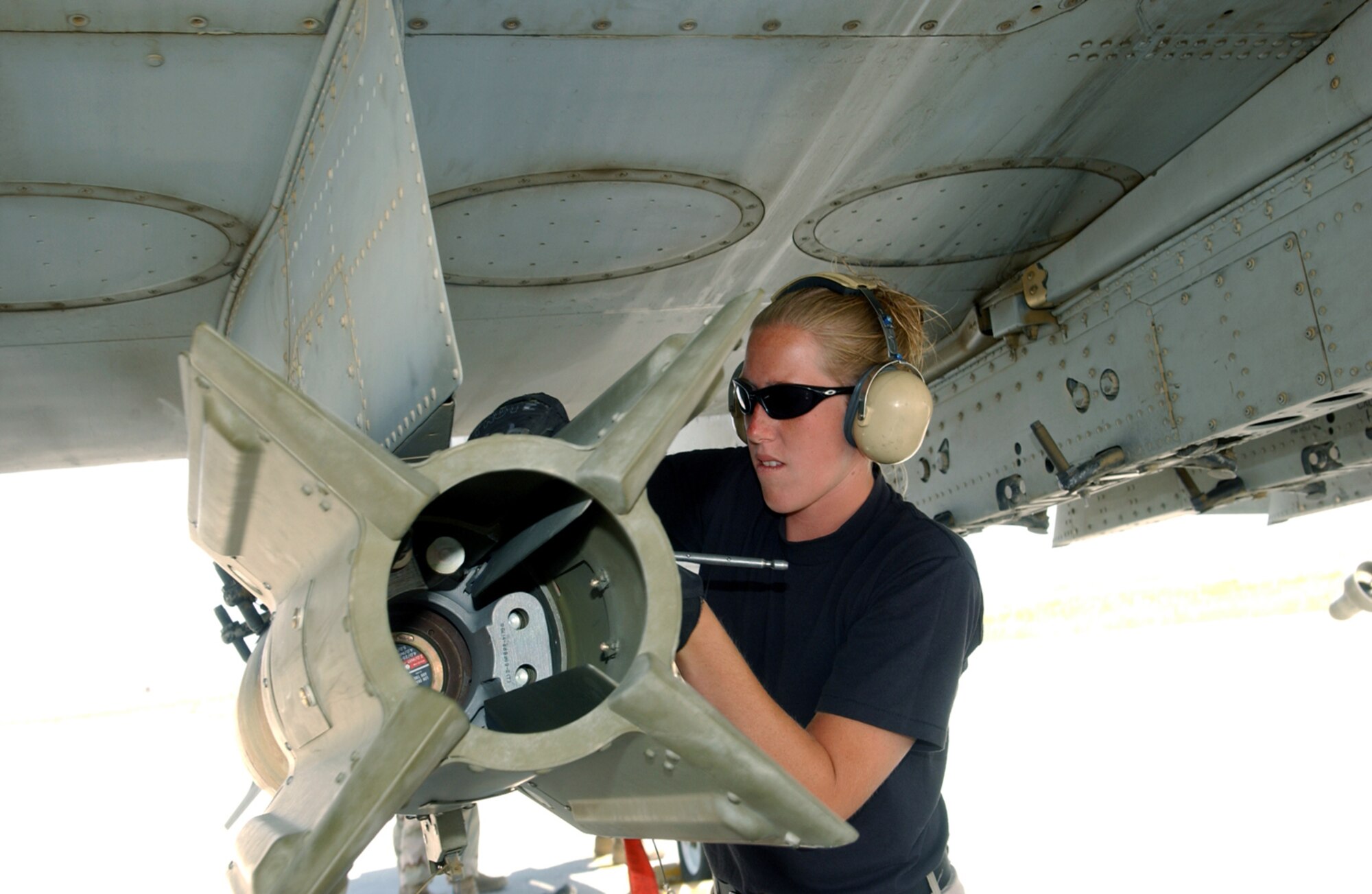 BAGRAM AIR BASE, Afghanistan -- Airman 1st Class Stacy Wilson safes a guided bomb after an A-10 Thunderbolt II mission.  She is assigned to the 354th Expeditionary Aircraft Maintenance Squadron.  (U.S. Air Force photo by Master Sgt. Andrew Gates)
