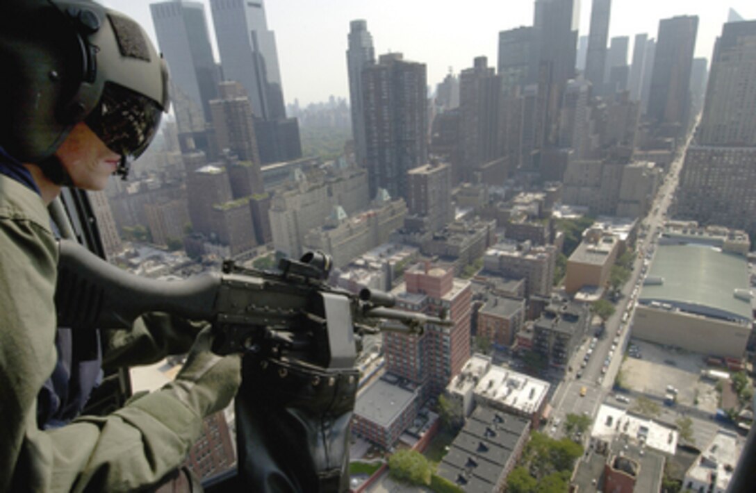 Coast Guard Petty Officer 2nd class Chris Karpf looks over New York City during security preparations for the Republican National Convention on Aug. 29, 2004. The U.S. Coast Guard is taking part in providing security during the convention. 