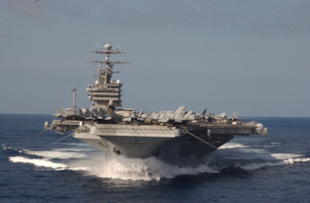 The aircraft carrier USS John C. Stennis (CVN 74) picks up speed as she steams through the western Pacific Ocean on Aug. 25, 2004. Stennis and her embarked Carrier Air Wing 14 are conducting exercises at sea on a regularly scheduled deployment. 