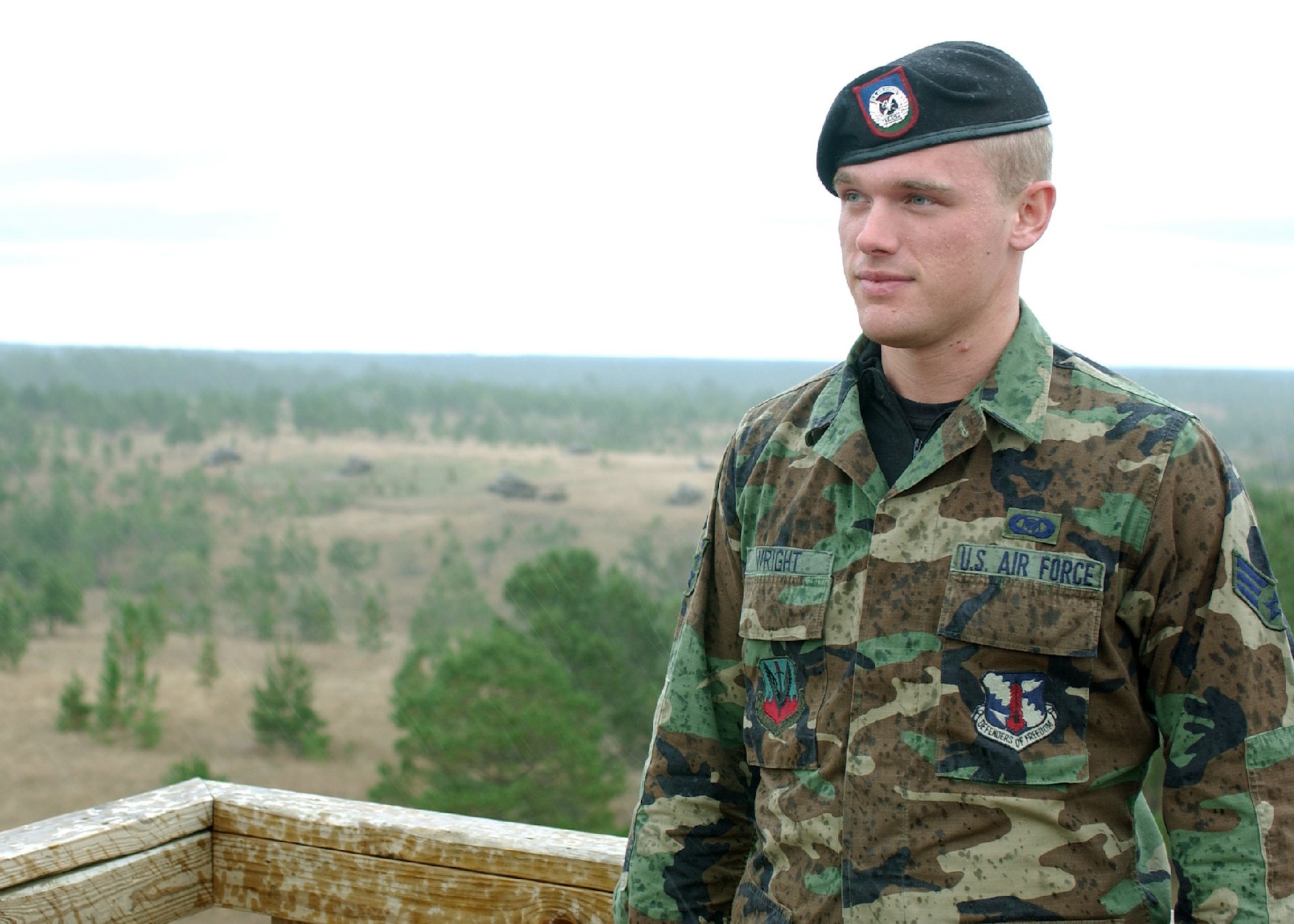 FORT POLK, La. -- Senior Airman Paul Wright stands at the top of the Losano-Frazier Tower here to pay tribute to Staff Sgt. Jacob Frazier, his fellow tactical air control party Airman from the 169th Air Support Operations Squadron of the Illinois Air National Guard in Peoria.  Sergeant Frazier was the first tactical controller killed in action since the inception of the career field during the Korean War.  (U.S. Air Force photo by Airman 1st Class Trina Flannagan)