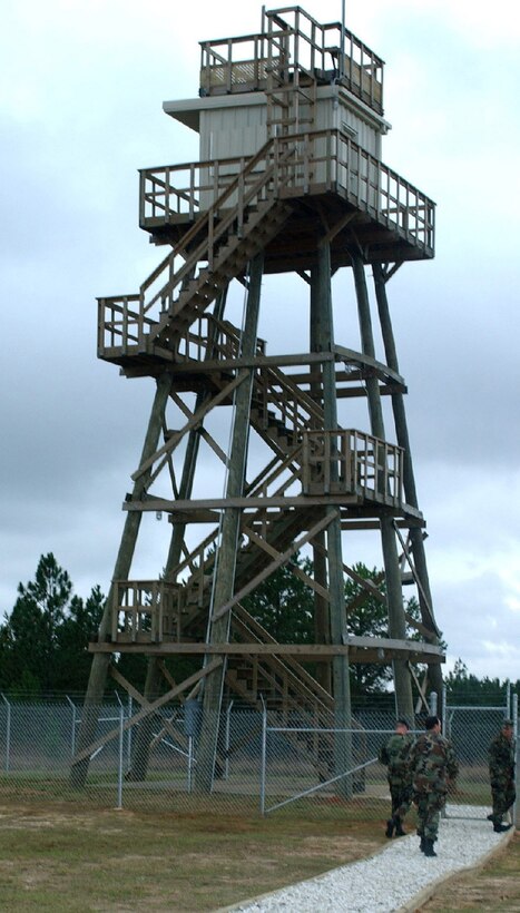 FORT POLK, La. -- Tactical air control party Airmen visit the 52-foot wooden range control tower here Nov. 30 following a dedication ceremony.  The tower was dedicated to Staff Sgt. Jacob Frazier and Airman 1st Class Raymond Losano.  They were the first tactical control Airmen killed in combat since the inception of the career field during the Korean War.  (U.S. Air Force photo by Airman 1st Class Trina Flannagan)