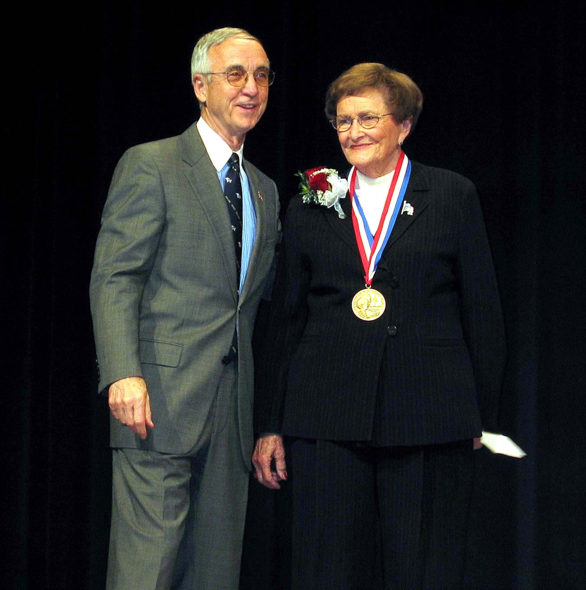 WASHINGTON -- Dorothy Hunt Finley is this year's recipient of the Zachary and Elizabeth Fisher Distinguished Civilian Humanitarian Award.  Navy Secretary Gordon England presented Mrs. Finley with the award at a Dec. 2 Pentagon ceremony.  She is a leading member of the Davis-Monthan 50, an organization dedicated to supporting Airmen and their families at Davis-Monthan Air Force Base, Ariz.  (U.S. Air Force photo by Kathleen T. Rhem)