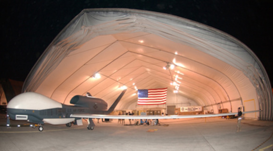 U.S. Air Force maintenance personnel prepare to move a Global Hawk unmanned aerial vehicle into its hangar after a recent surveillance and reconnaissance flight in support of Operation Iraqi Freedom on Nov. 8, 2004. 