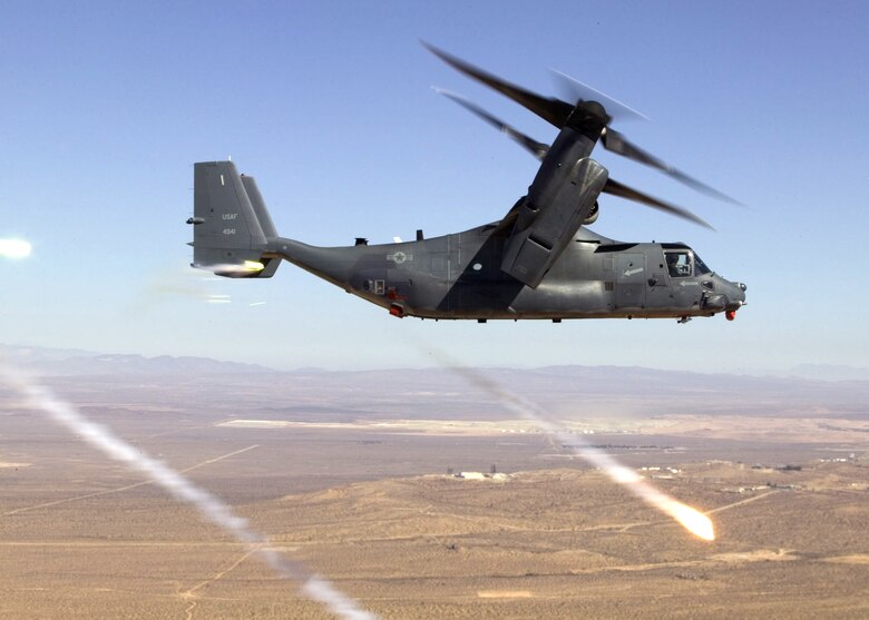 OVER EDWARDS AIR FORCE BASE, Calif. -- The CV-22 Osprey fires countermeasures out of one of the rear buckets, or storage areas for countermeasures, during a safe-separation test over the precision impact range area here. (Courtesy photo by Kevin Kidd)  