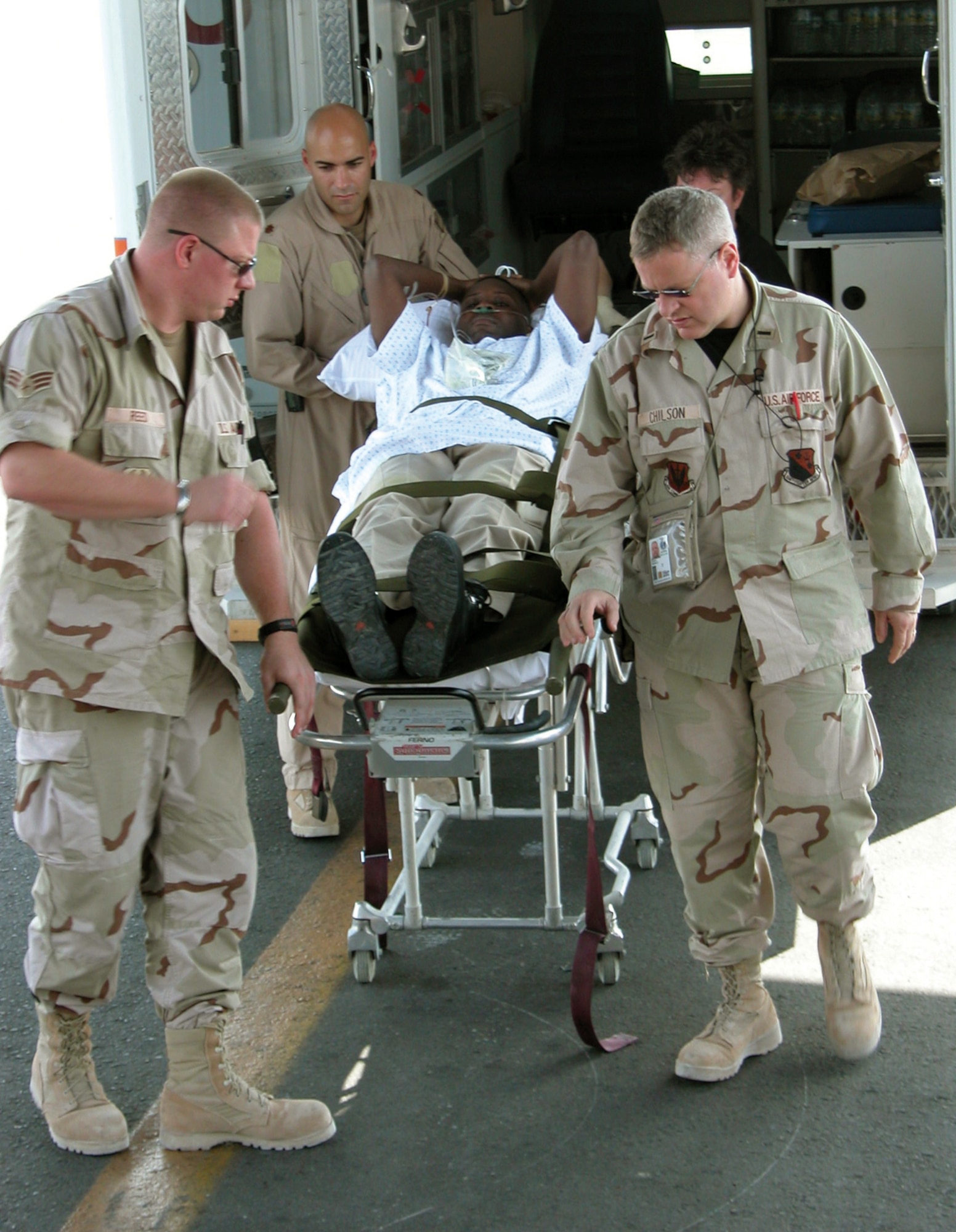 SOUTHWEST ASIA -- Master Sgt. Maxie Gainey secures litters holding aeromedical evacuation supplies during a mission.  He is a C-130 Hercules loadmaster deployed from Pope Air Force Base, N.C.  (U.S. Air Force photo by Capt. Mae-Li Allison)
