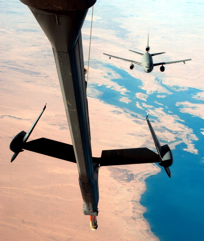 OVER IRAQ -- A KC-10 Extender, piloted by Capt. Melissa Nadeau with 908th Expeditionary Air Refueling Squadron, approaches another KC-10 to transfer fuel while flying missions here recently in support of Operation Iraqi Freedom.  The KC-10 Extender can both give and receive fuel.  (U.S. Air Force photo by Tech. Sgt. Erik Gudmundson)