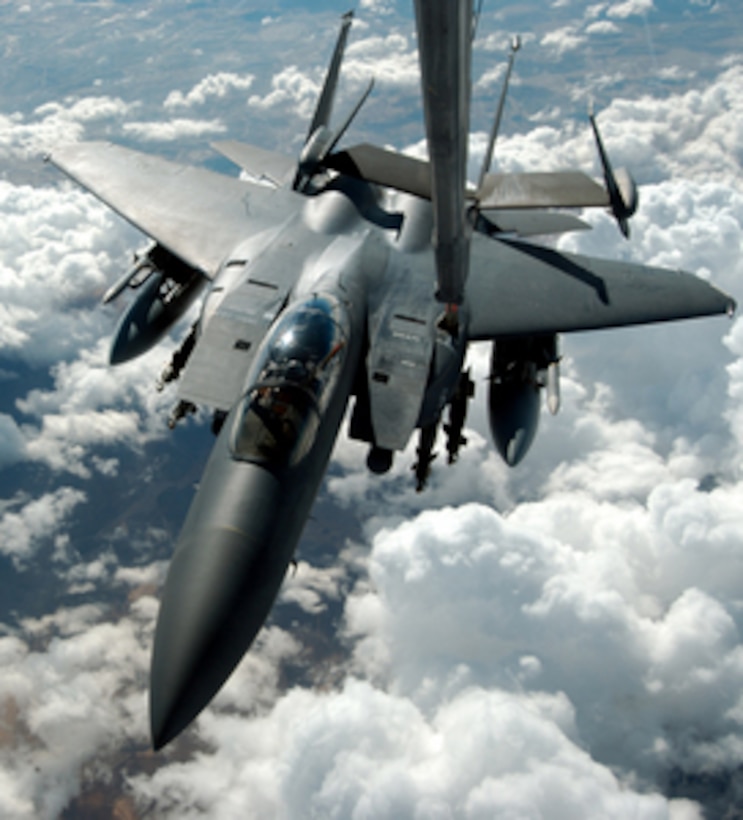 A U.S. Air Force F-15 Strike Eagle is refueled inflight from a KC-10 Extender during a mission over Iraq on Nov. 18, 2004. 