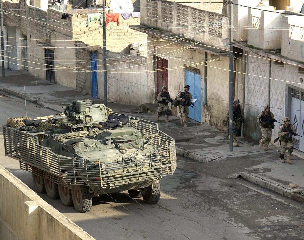 MOSUL, Iraq -- Stryker brigade combat team Soldiers search for insurgents here recently.  (U.S. Army photo by Sgt. Jeremiah Johnson)