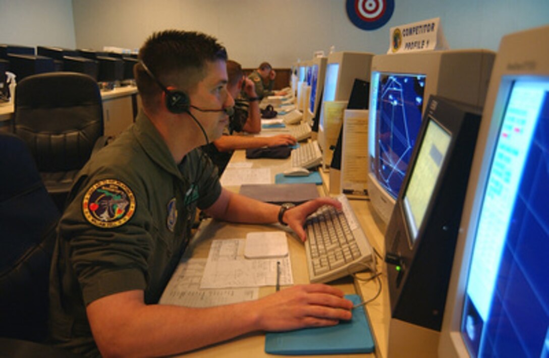 U.S. Air Force Master Sgt. Charles Hayworth directs F-15 Eagles to aerial targets during Exercise William Tell 2004 at Tyndall Air Force Base, Fla., on Nov. 13, 2004. The two-week long William Tell competition tests the abilities of aircrews to perform in a combat environment. Hayworth is assigned as a weapons director with the 962nd Air Control Squadron, Elmendorf Air Force Base, Alaska. 