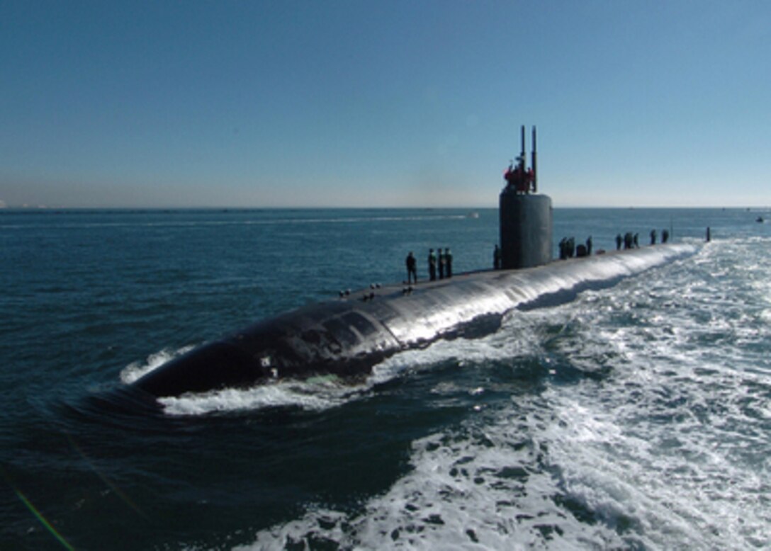 Sailors aboard the USS Topeka (SSN 754) prepare the mooring lines as the submarine enters port on Nov. 24, 2004, after being underway for three days off the coast of California. The Los Angeles class attack submarine participated in the Submarine Squadron 11 Chef Exchange program. Chef Paul Murphy from Humphrey's by the Bay San Diego spent three days and two nights giving the submarine's cooks tips and advice on how to improve the quality of food and service onboard. 
