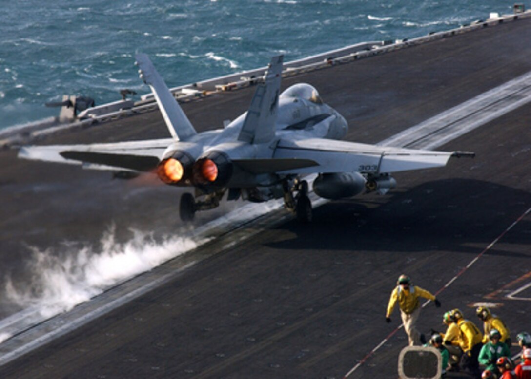 An F/A-18C Hornet hurtles down the catapult to launch from the flight deck of the aircraft carrier USS Harry S. Truman (CVN 75) as it operates in the Persian Gulf on Nov. 23, 2004. The Hornet is assigned to Strike Fighter Squadron 37. Truman's Carrier Strike Group 10 and embarked Carrier Air Wing 3 are deployed in support of the Global War on Terror. 
