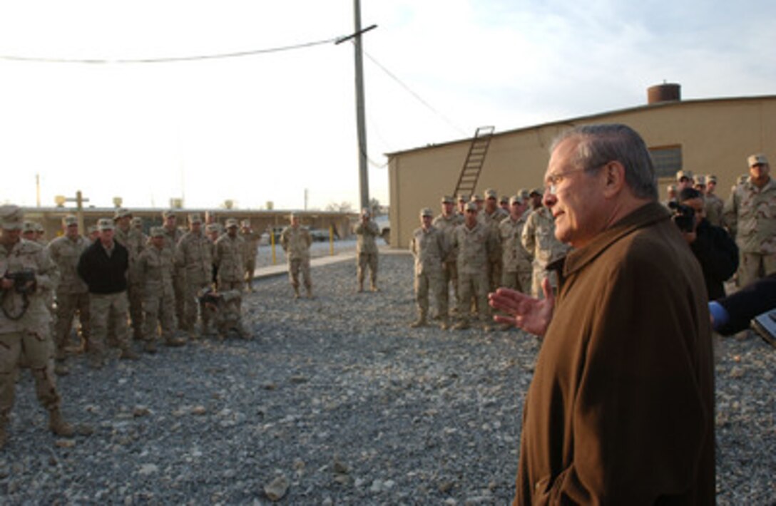 Secretary of Defense Donald H. Rumsfeld visits Combined Joint Special Operations Task Force Service members at Bagram Air Base, Afghanistan, on Dec. 7, 2004. Rumsfeld is in Afghanistan to attend the first Presidential Inauguration of Afghanistan President Hamid Karzai and to visit troops deployed for Operation Enduring Freedom. 