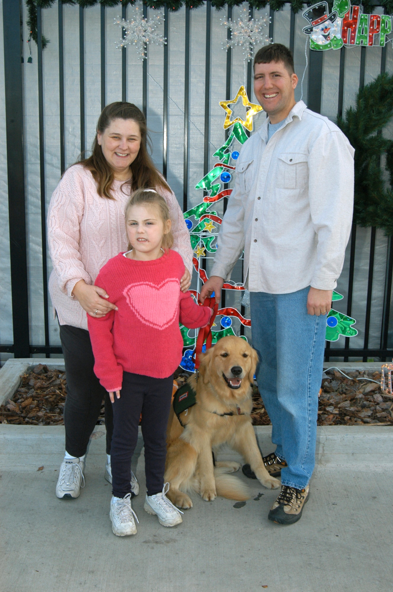 SCHRIEVER AIR FORCE BASE, Colo. -- The Rizzo family poses with Berkley.  (Courtesy photo)