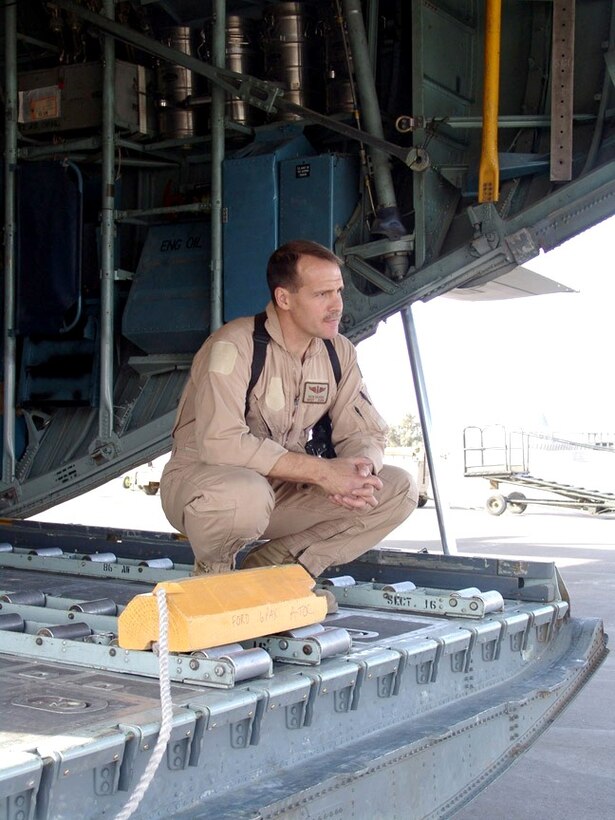 SOUTHWEST ASIA -- Master Sgt. Richard Baarda waits on the ramp of a C-130 Hercules for a pallet of cargo to be brought onboard.  He and other Airmen of the 746th Expeditionary Airlift Squadron and its sister squadron, the 386th EAS, provide tactical airlift supporting Operation Iraqi Freedom as part of the 386th Air Expeditionary Wing.  Sergeant Baarda is a loadmaster.  (U.S. Air Force photo by Capt. Aaron Burgstein)