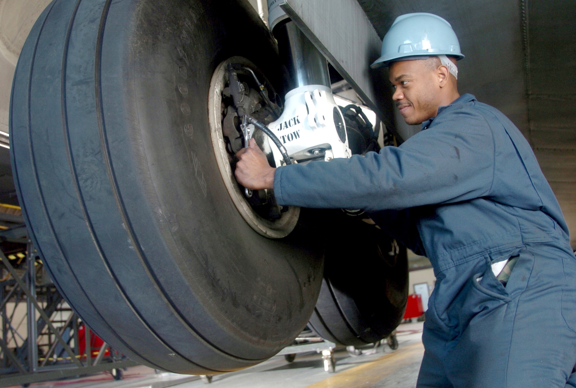 YOKOTA AIR BASE, Japan -- Staff Sgt. William Henderson inspects a C-130 Hercules landing gear during an isochronal inspection.  Pacific Air Force C-130s undergo a major inspection here once a year to ensure that the fleet is in top condition.  Sergeant Henderson is a repair and reclamation technician from the 374th Maintenance Squadron.  (U.S. Air Force photo by Master Sgt. Val Gempis)