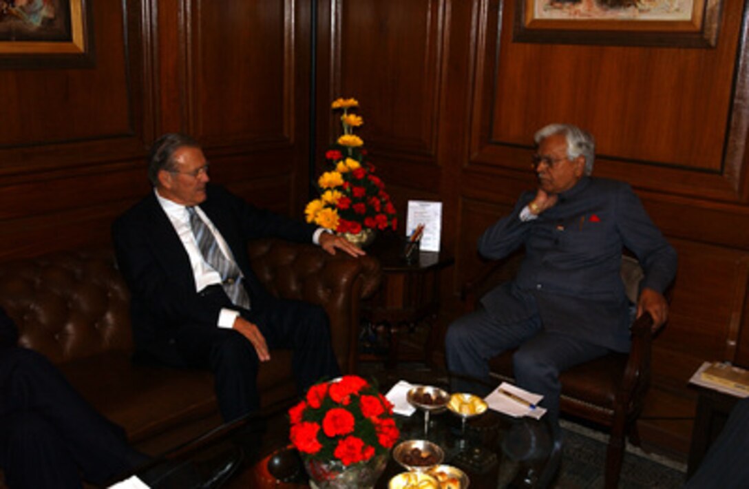 Secretary of Defense Donald H. Rumsfeld (left) meets with India's Minister of Foreign Affairs K. Natwar Singh at the South Block building in New Delhi, India, on Dec. 9, 2004. Rumsfeld is in India to meet with India's senior leadership to discuss defense issues of mutual interest and the war on terror. 