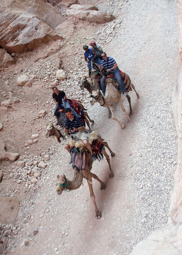 PETRA, Jordan, (Aug. 21, 2008) --Marines with the 15th Marine Expeditionary Group take a camel ride during a tour of Petra, August 21, 2008. ::r::::n::While conducting training in Jordan roughly 1,400 Marines with the 15th MEU were afforded the opportunity to tour Petra, one of the new seven wonders of the world, in an effort to enhance the Marines cultural understanding in a foreign land.::r::::n::The Camp Pendleton, Calif. based 15th MEU is comprised of approximately 2,200 Marines and Sailors and is a forward deployed force in readiness capable of conducting numerous operations, such as Non-Combatant Evacuation Operations, Humanitarian Assistance Operations and a wide range of amphibious missions. The 15th MEU is currently deployed aboard USS Peleliu (LHA-5), USS Dubuque (LPD-8) and USS Pearl Harbor (LSD-52).::r::::n::(Official USMC photo by Cpl. Stephen Holt)(Released)::r::::n::