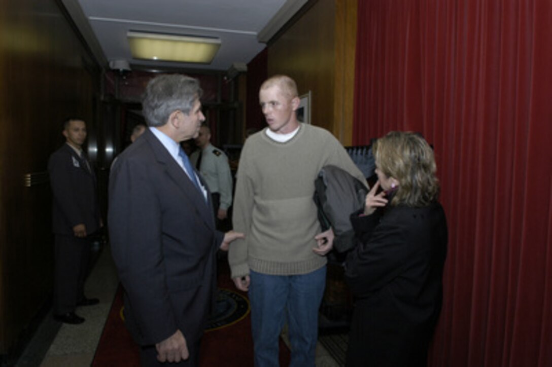 Deputy Secretary of Defense Paul Wolfowitz (left) thanks one of his dinner guests for coming to the Pentagon on Dec. 9, 2004. Wolfowitz hosted the dinner in the Pentagon to honor some of the service men and women wounded in Iraq and Afghanistan and presently at Walter Reed Army Medical Center and Bethesda Naval Hospital. 