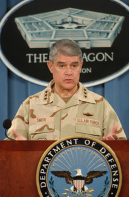 Deputy Commander U.S. Central Command Lt. Gen. Lance L. Smith, U.S. Air Force, presents an operational update on Iraq to reporters in the Pentagon on Dec.15, 2004. 