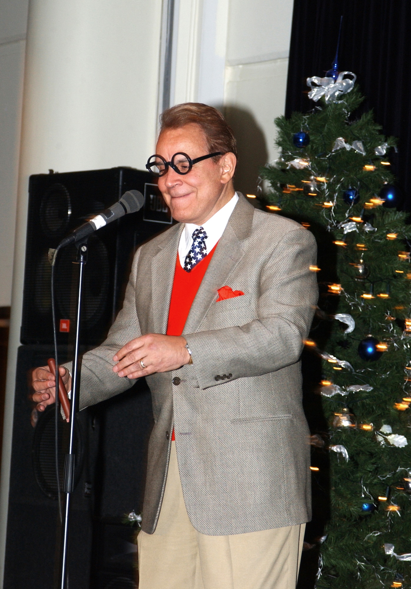 INCIRLIK AIR BASE, Turkey -- Comedian and impersonator  Rich Little performs here Dec. 13 as part of the United Service Organizations and Armed Forces Entertainment 2004 Holiday Tour.  (U.S. Air Force photo by Senior Airman Dallas Edwards)
