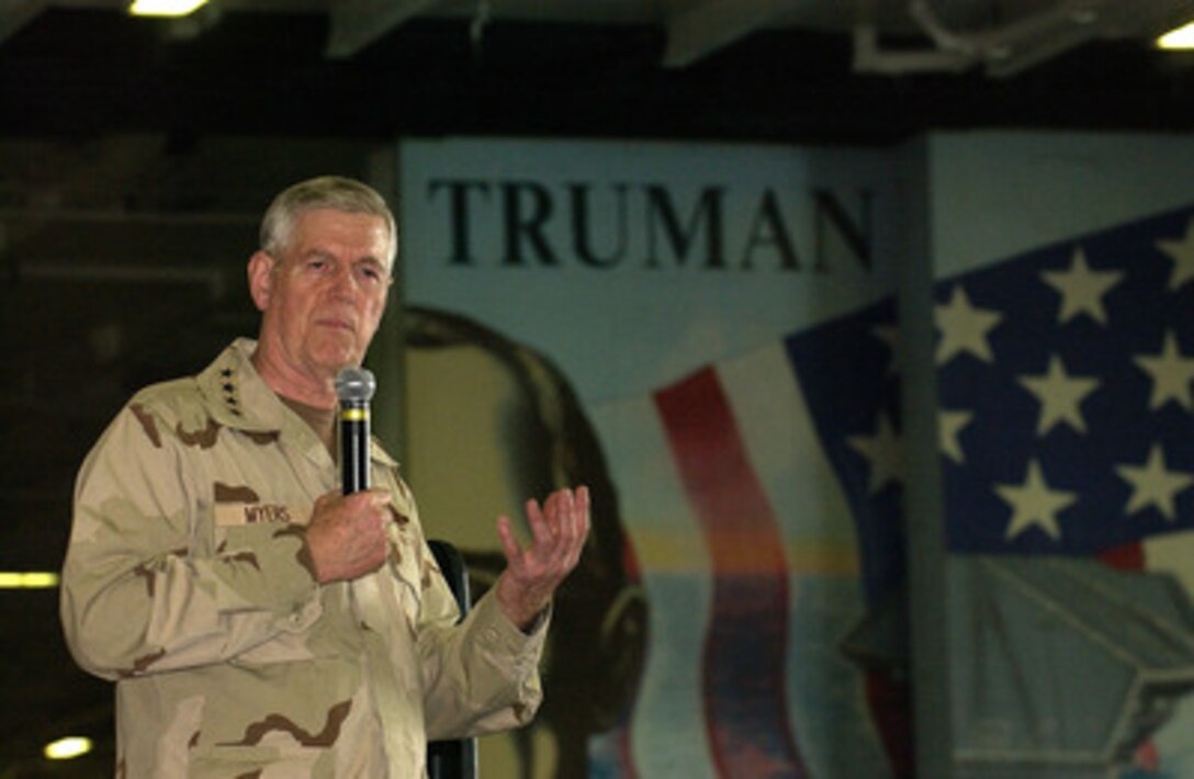 Chairman of the Joint Chiefs of Staff Gen. Richard B. Myers, U.S. Air Force, talks to the sailors aboard the aircraft carrier USS Harry S. Truman (CV 75) anchored near Manama, Bahrain, on Dec. 15, 2004. Myers brought a United Services Organization show featuring Blake Clark, John Elway, Leann Tweeden and Robin Williams to the Truman to meet, entertain and thank the deployed sailors. 