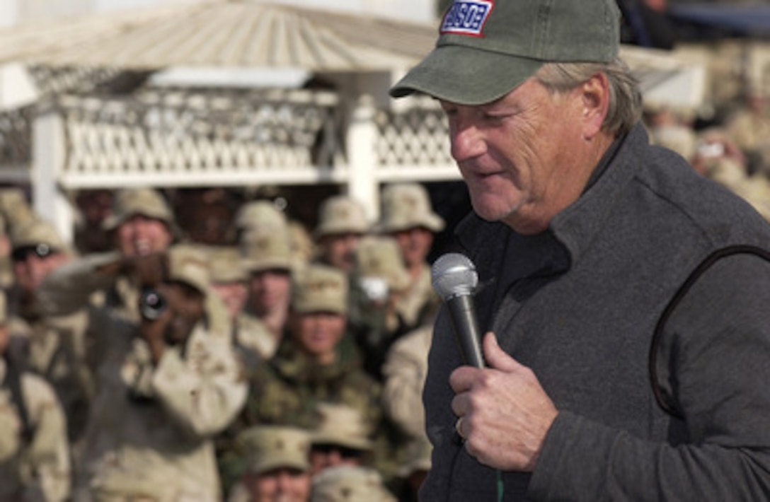 Actor/comedian Blake Clark brings out the laughs from his audience of U.S. service men and women during a United Services Organization show at Camp Victory, Iraq, on Dec. 14, 2004. Vietnam Veteran Clark joined Chairman of the Joint Chiefs of Staff Gen. Richard B. Myers, U.S. Air Force, John Elway, Leann Tweeden and Robin Williams on the USO tour to meet, entertain and thank the deployed troops. 