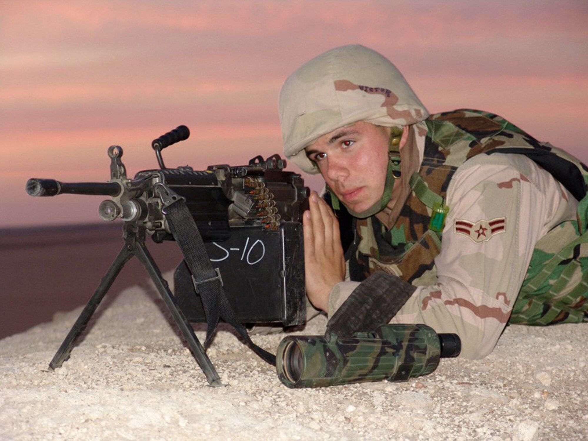 SOUTHWEST ASIA --  Airman 1st Class Brian Corso, 386th Expeditionary Security Forces Squadron Viper Flight, observes the surrounding area to ensure there are no threats to aircraft landing and taking off here.  The 386th ESFS is responsible for defending the 386th Air Expeditionary Wing's base from attack.  (U.S. Air Force photo by Senior Airman Nicole Spence)