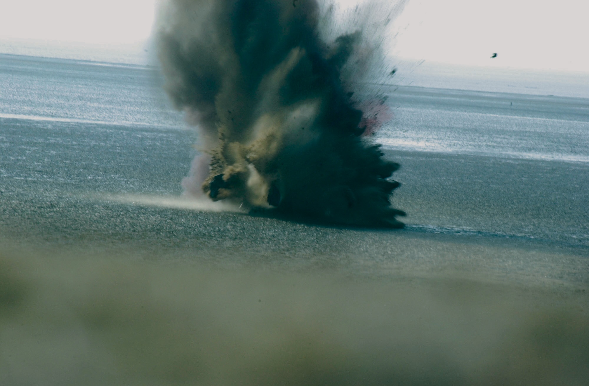KUNSAN AIR BASE, South Korea -- Airmen of the 8th Civil Engineer Squadron explosive ordnance disposal flight destroy the warhead portion of a Korean War-era bazooka round here Dec. 16.  (U.S Air Force Photo by Staff Sgt. Alan Port)