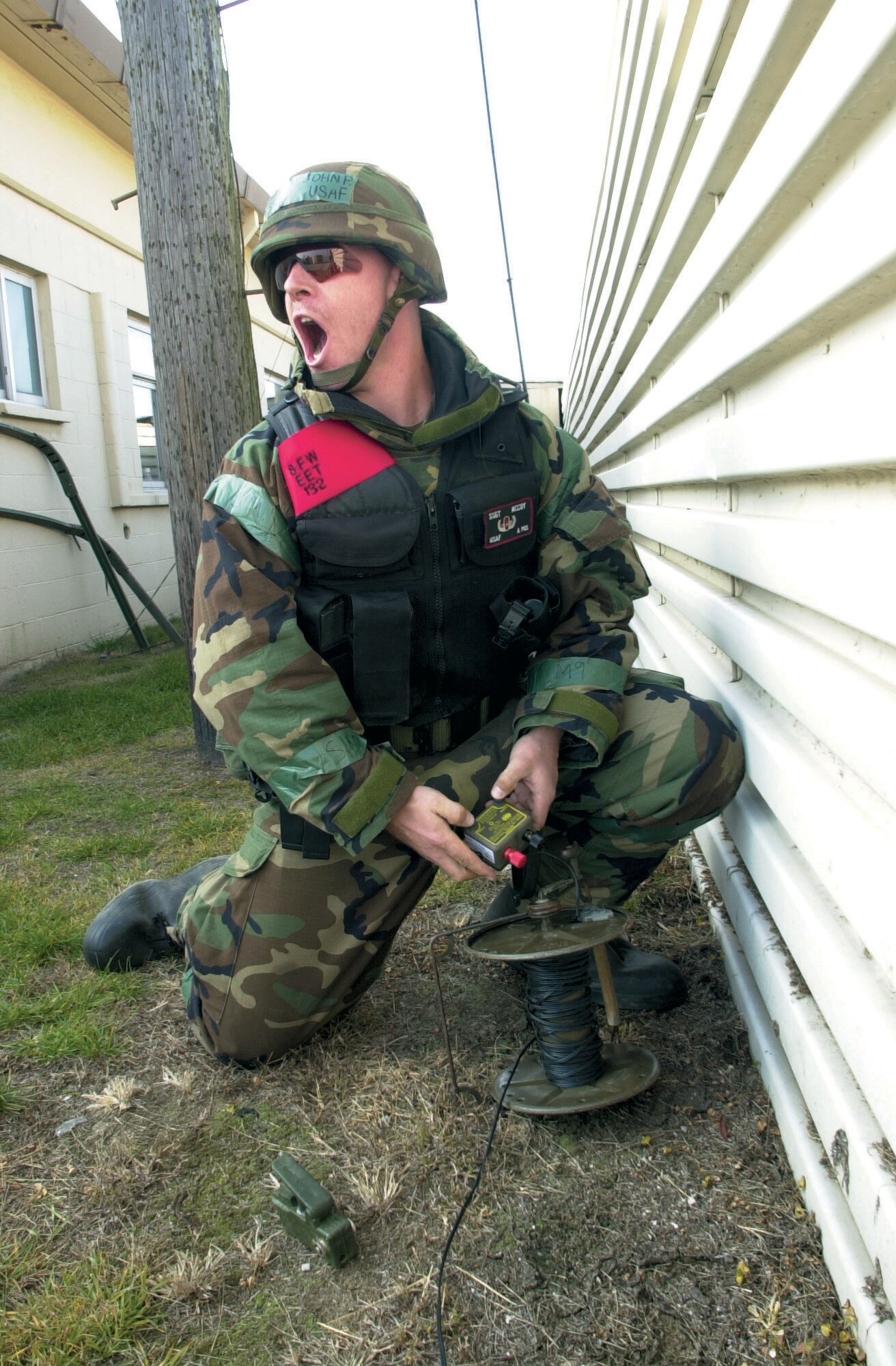 KUNSAN AIR BASE, South Korea -- Staff Sgt. John McCoy yells out a safety call Dec. 16 to warn people that they are about to detonate a bazooka round.  He is assigned to the 8th Civil Engineer Squadron explosive ordnance disposal flight.  (U.S Air Force Photo by Staff Sgt. Alan Port)