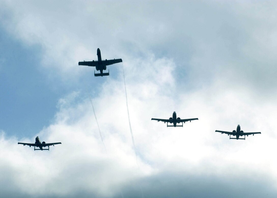 PERLE, Luxemburg -- A-10 Thunderbolt IIs from the 81st Fighter Squadron at Spangdahlem Air Base, Germany, fly over a ceremony commemorating the 60th Anniversary of the Battle of the Bulge here.  (U.S. Air Force photograph by Master Sgt. John E. Lasky)